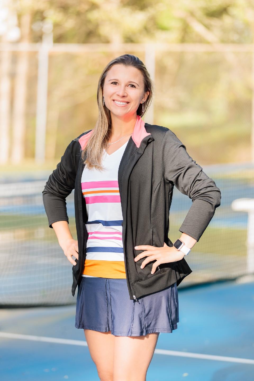 Portrait of tennis coach posing on a court